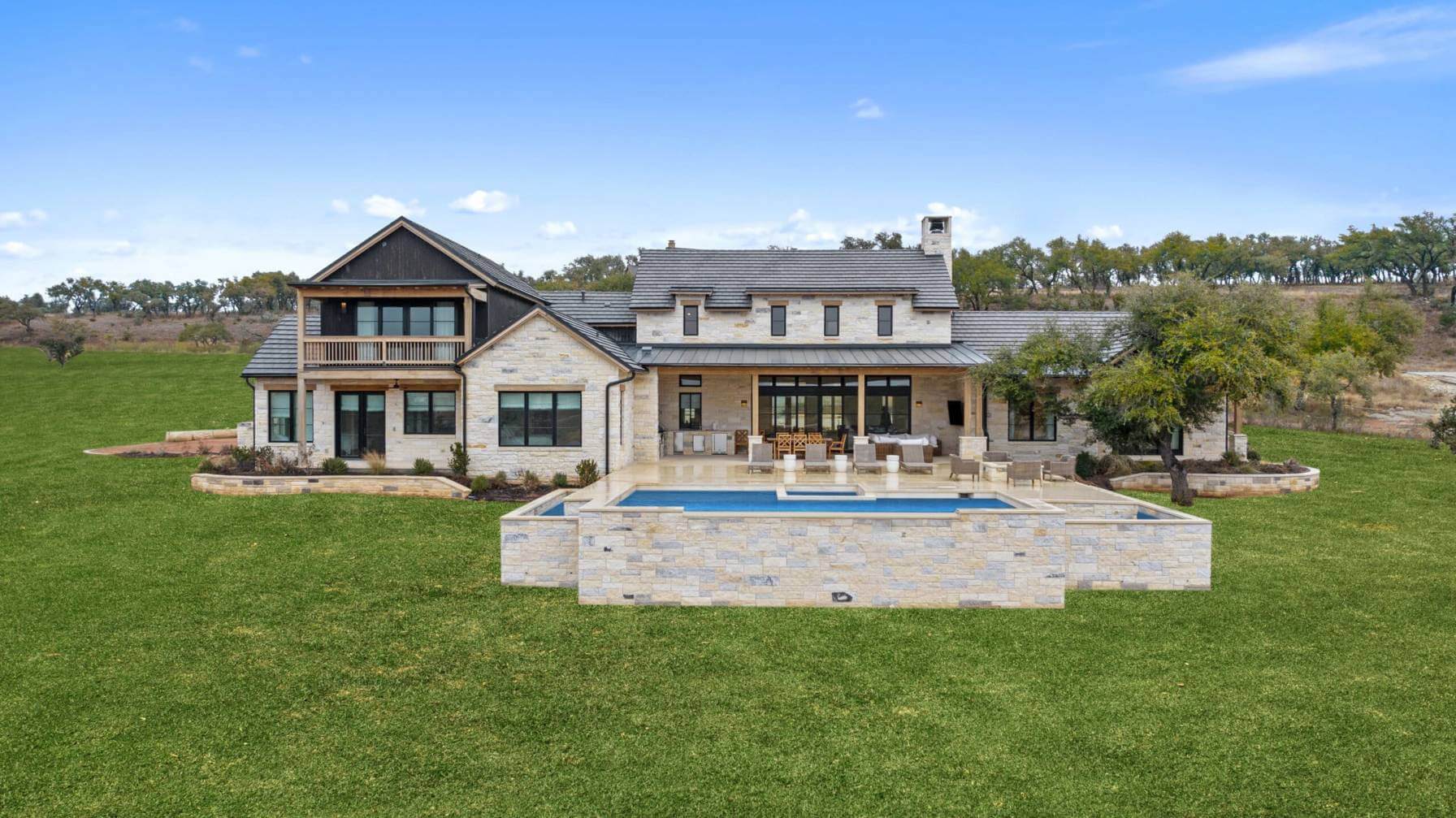 Newly built brick accented home with back yard pool in Llano, Texas